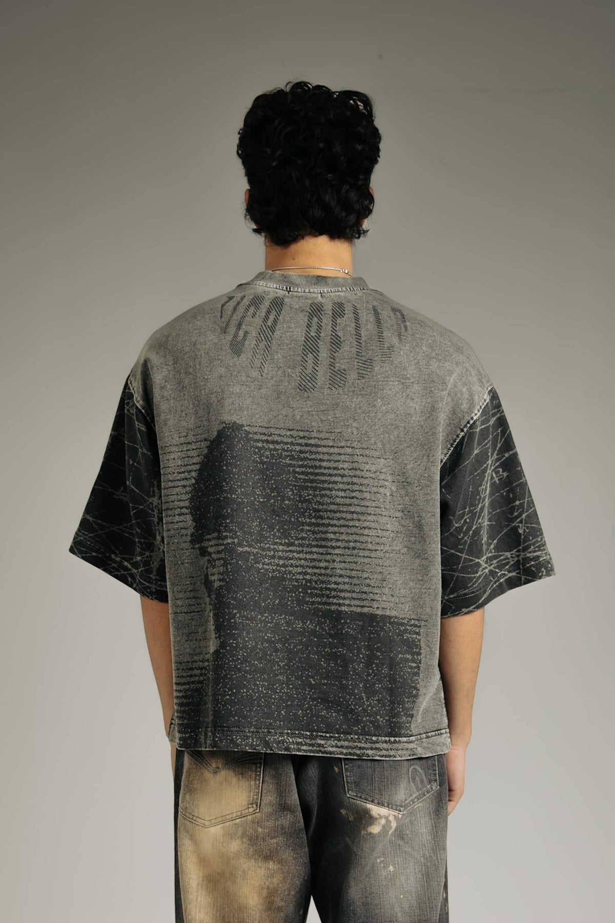 Black acid-wash t-shirt for men, stylish and edgy streetwear fashion, perfect for casual wear