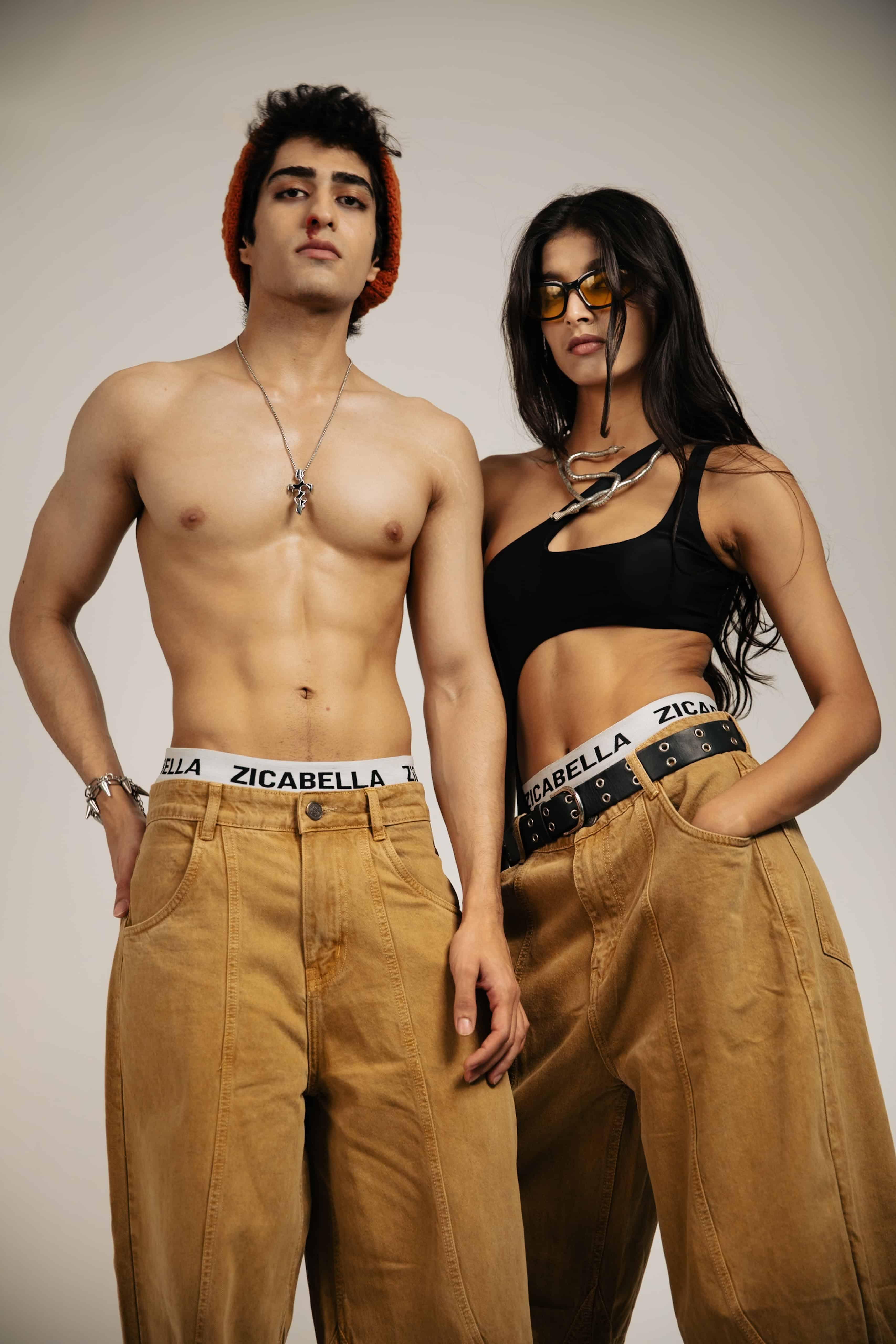 Beige cotton jeans with a loose fit, designed with a streetwear aesthetic