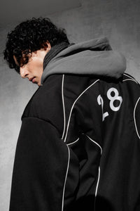 Close-up detail of black oversized cotton blend tracksuit hoodie