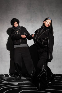Black oversized tracksuit styled as contemporary streetwear outfi