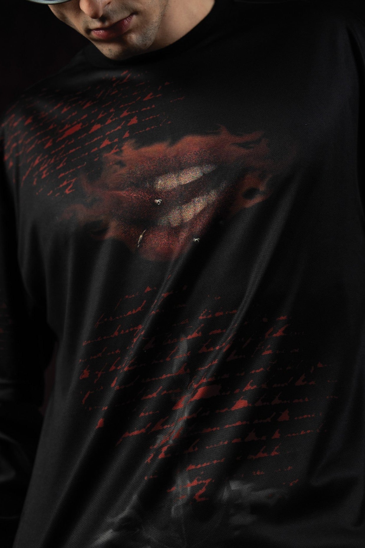 Zica Bella Bloodzic Jersey 01 black streetwear jersey with red glitch graphic design close up front detail
