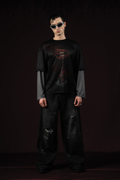 Zica Bella Bloodzic Jersey 01 black oversized streetwear jersey with red glitch graphic worn by male model portrait front view

