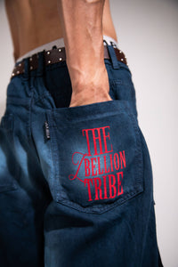 Dark blue heavyweight denim cargo showcasing utility pocket detail and streetwear design