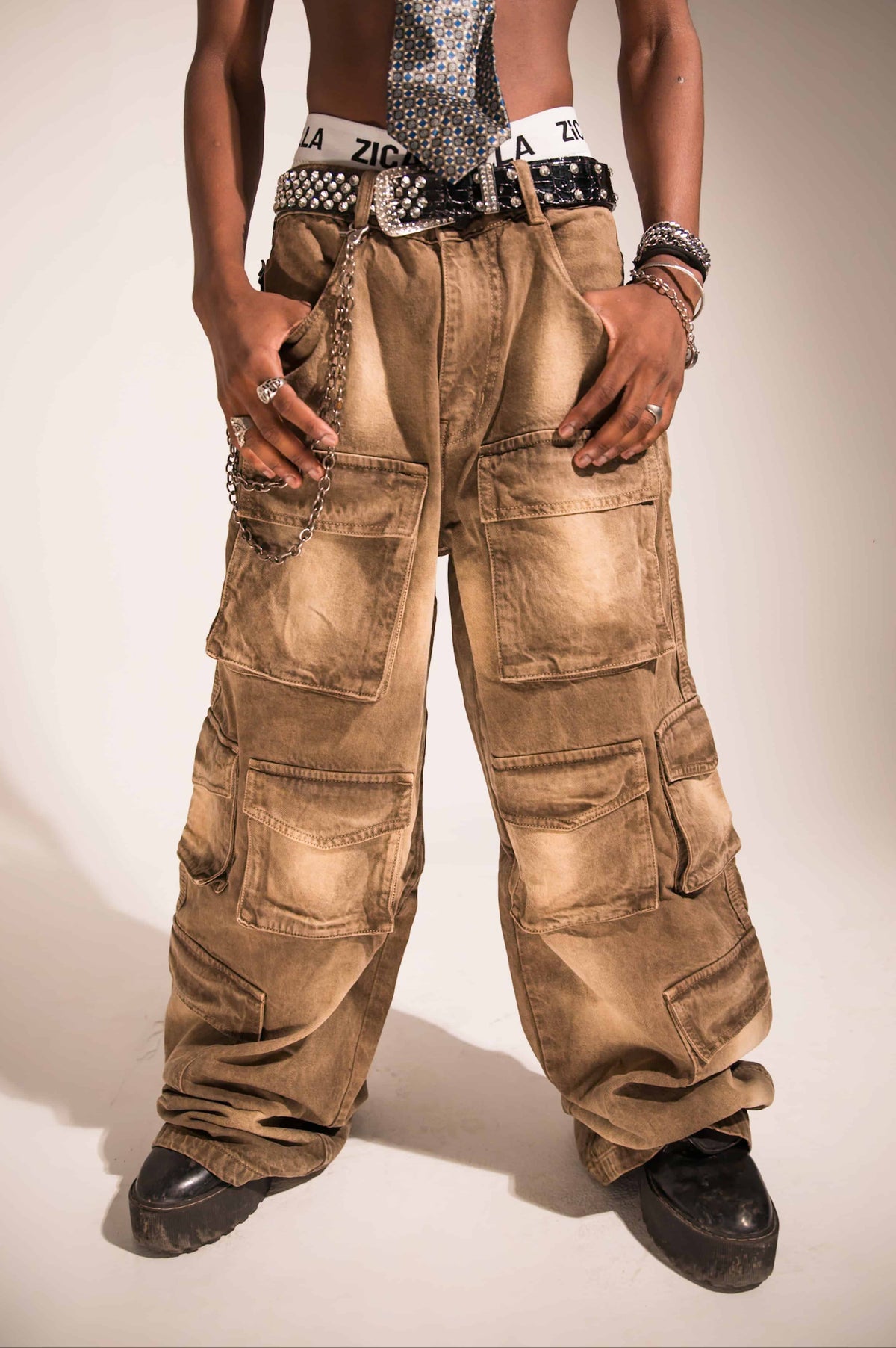 brown denim cargo featuring textured utility pockets and a relaxed streetwear silhouette