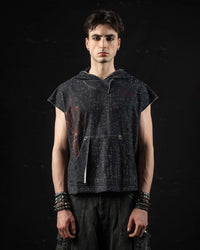 Minimalist portrait highlighting the oversized fit and distressed texture of a mythic hooded tee
