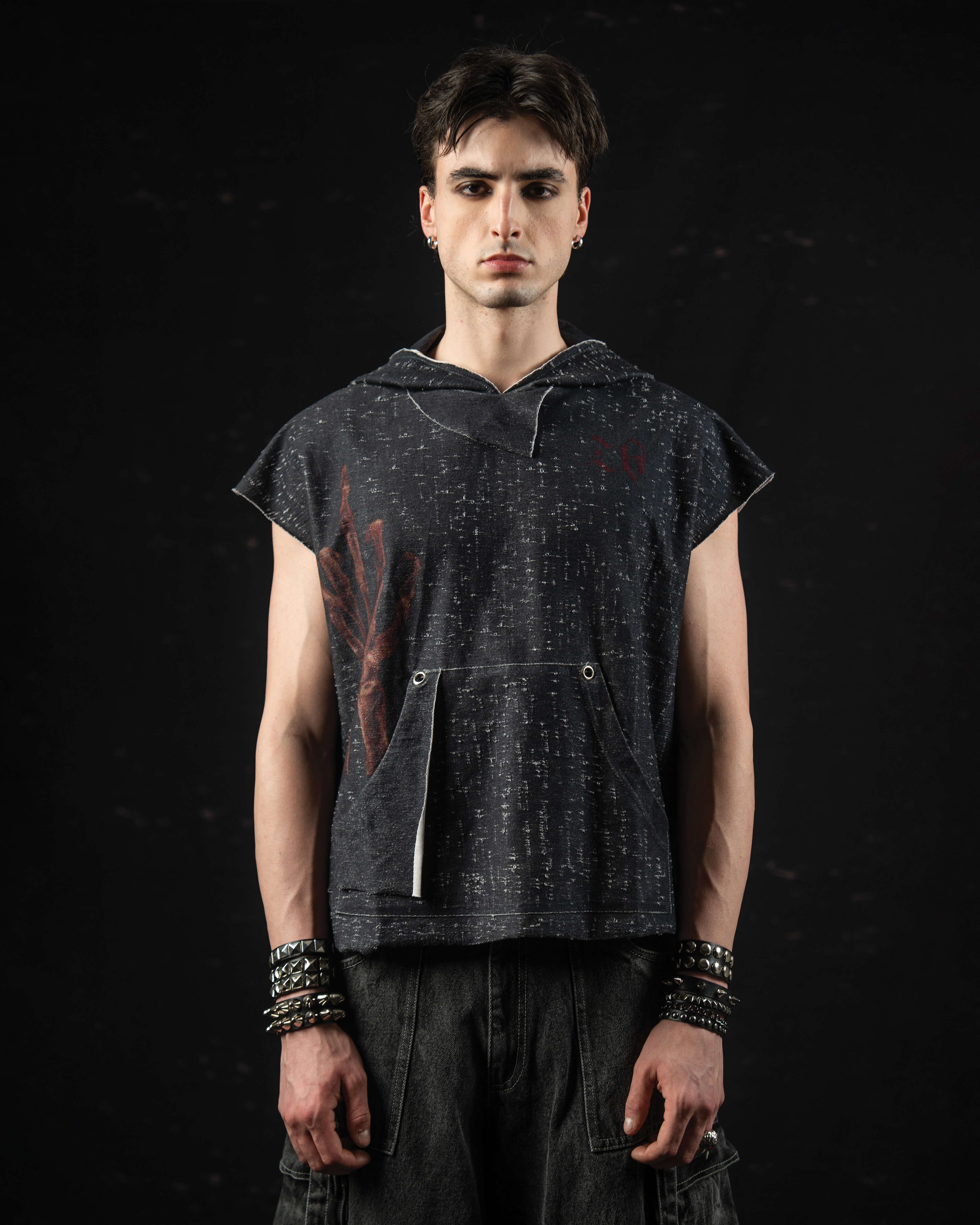 Minimalist portrait highlighting the oversized fit and distressed texture of a mythic hooded tee