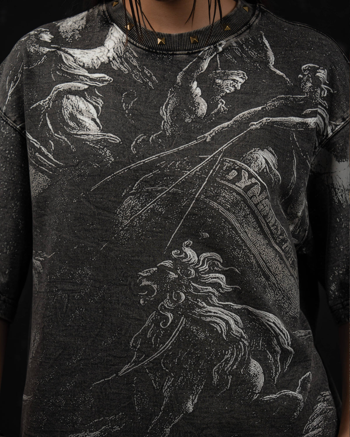 Detailed close-up of the vintage-inspired mythic artwork printed on a washed charcoal oversized t-shirt