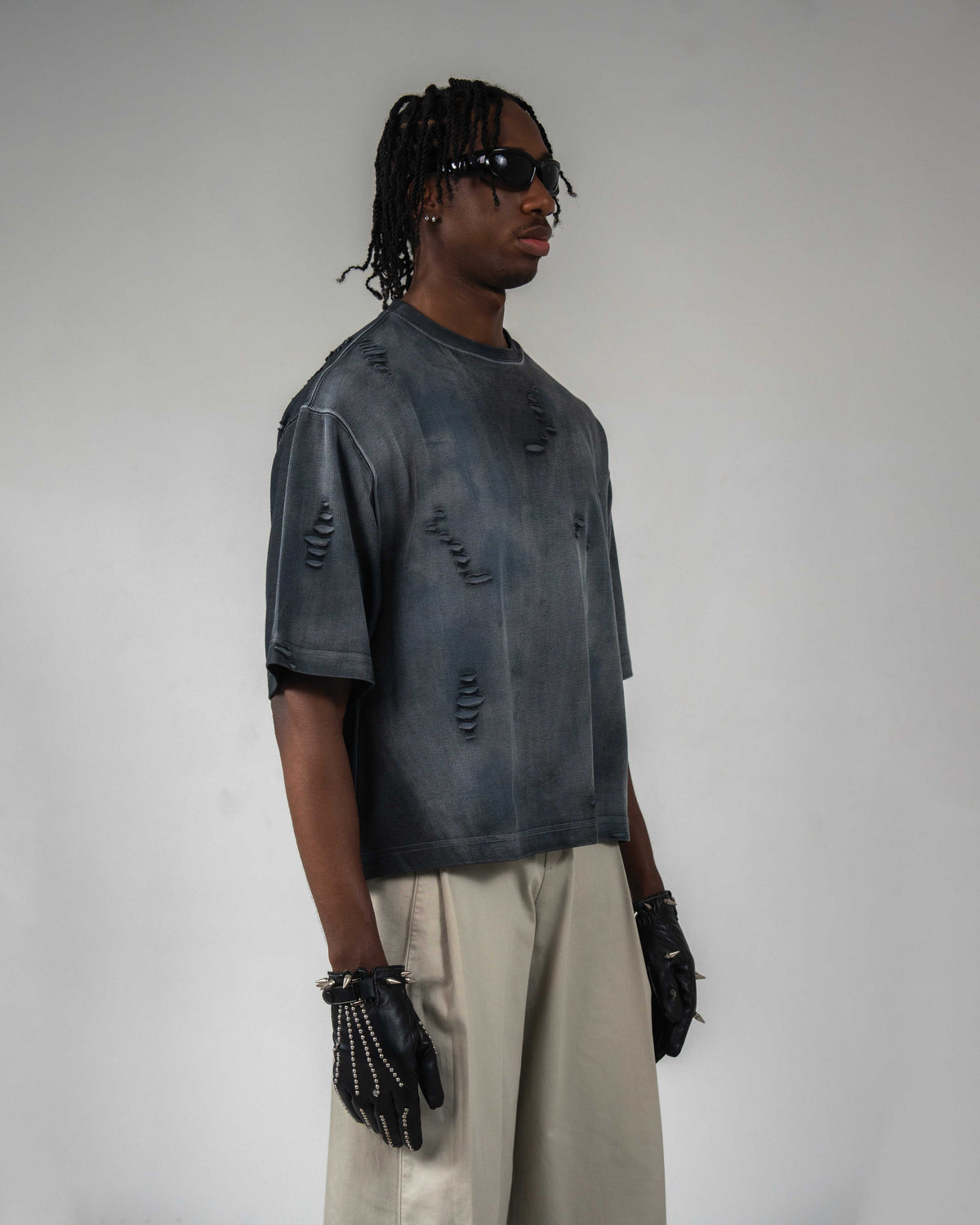 Side profile of DRYXEN oversized acid wash black streetwear tee