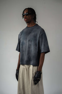 Side angle view of faded black distressed unisex streetwear t-shirt