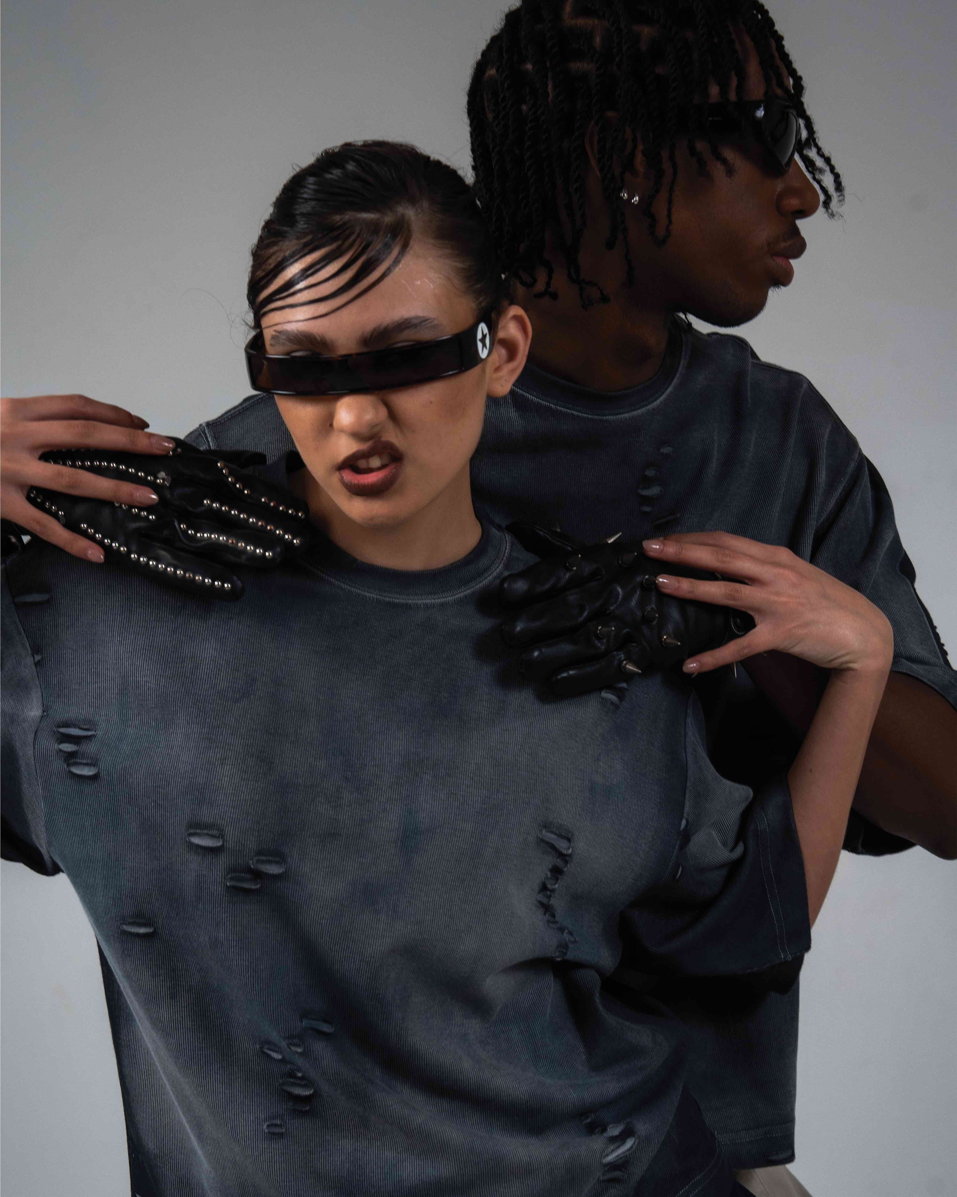 Male and female models styling DRYXEN oversized distressed streetwear t-shirts