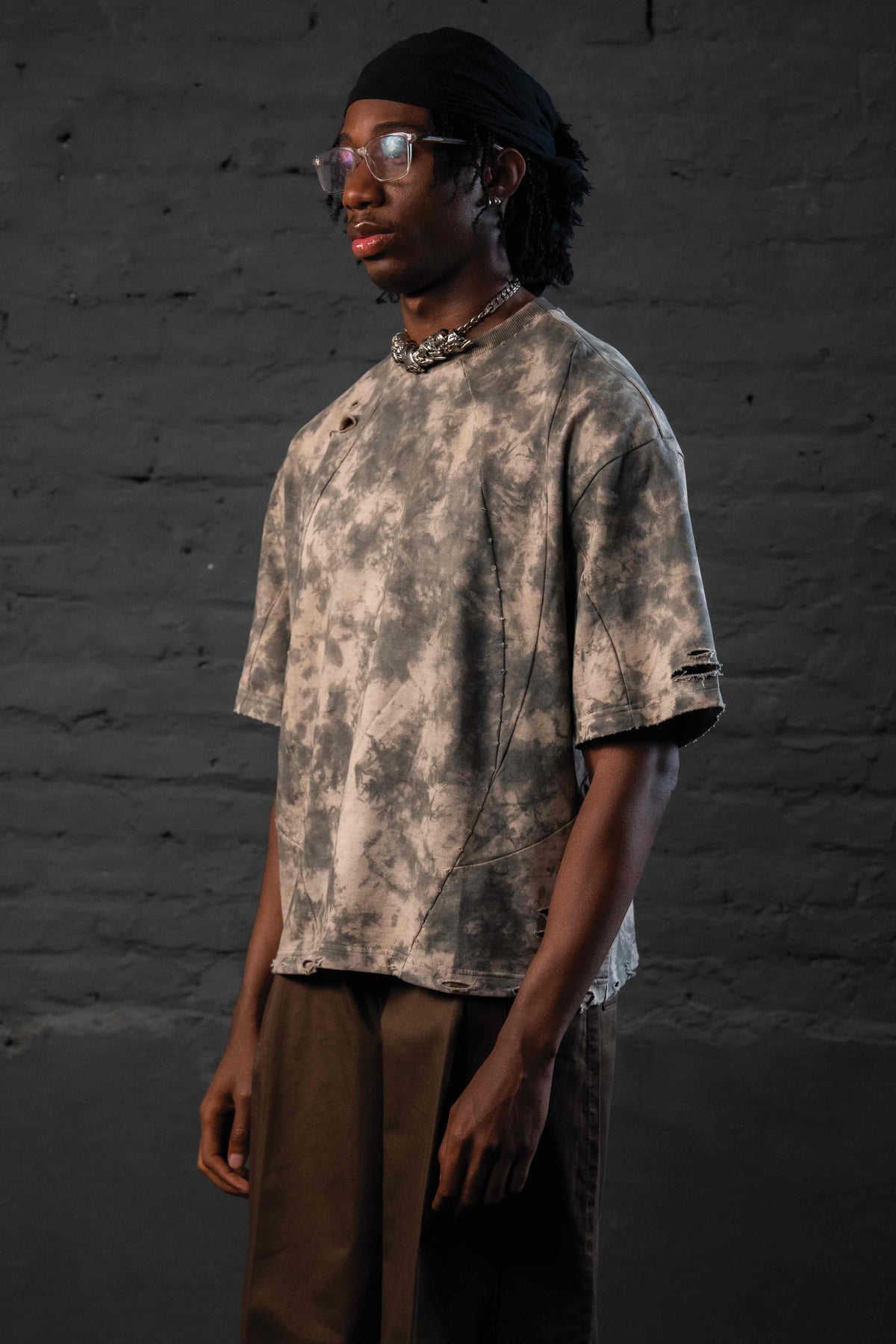 Model wearing GRAINDUST RAW TEE heavyweight oversized drop shoulder streetwear t shirt
