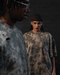 Fashion editorial focus shot of GRAINDUST RAW TEE distressed oversized streetwear tee