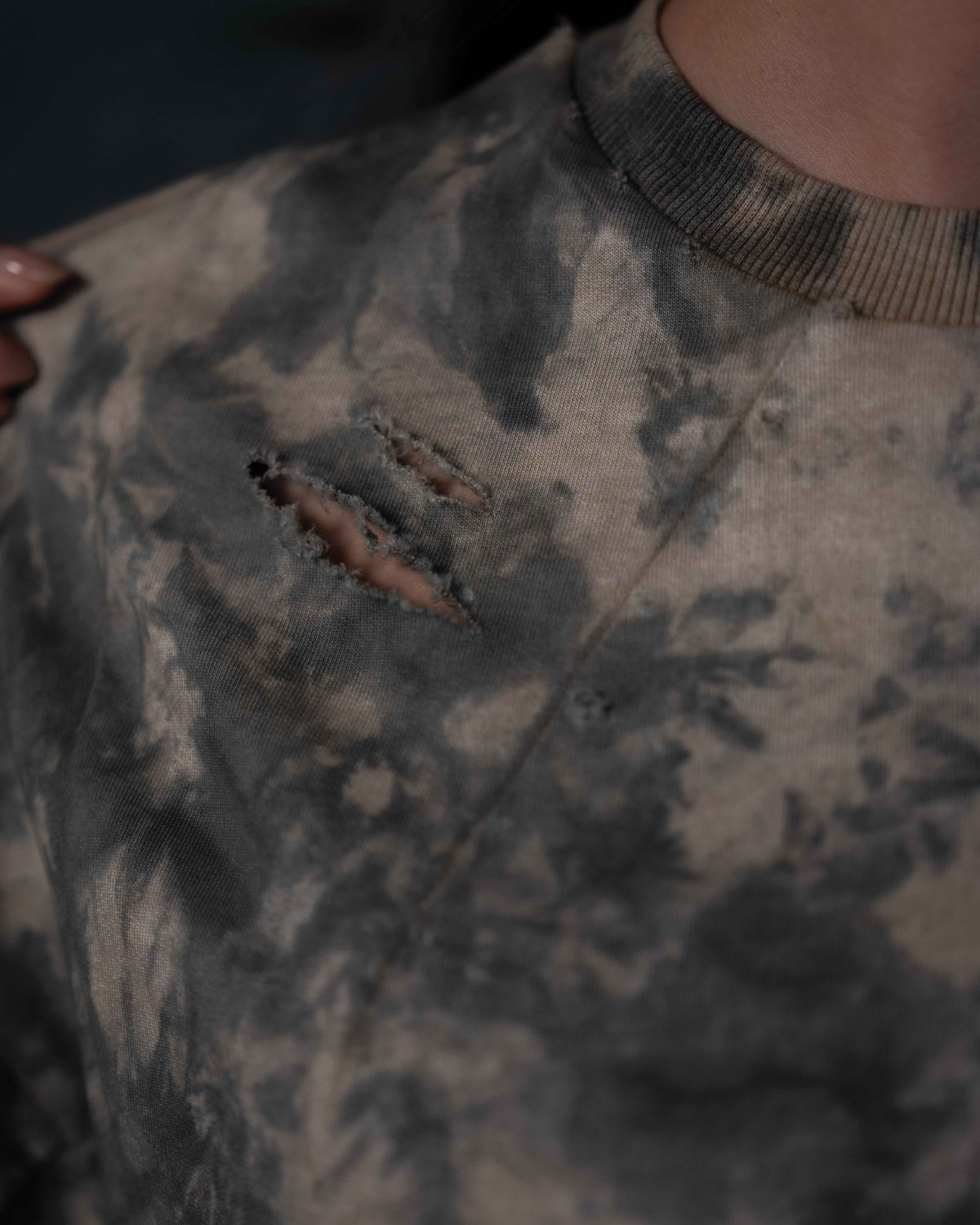 Hand distressed rip detail on GRAINDUST RAW TEE acid wash oversized tee