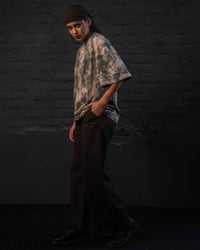 Female model wearing GRAINDUST RAW TEE oversized luxury streetwear t shirt