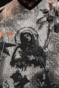 Detailed close-up of the front print placement and V-neckline structure on the oversized jersey
