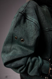 Premium fabric texture of green hoodie with soft finish and durable material