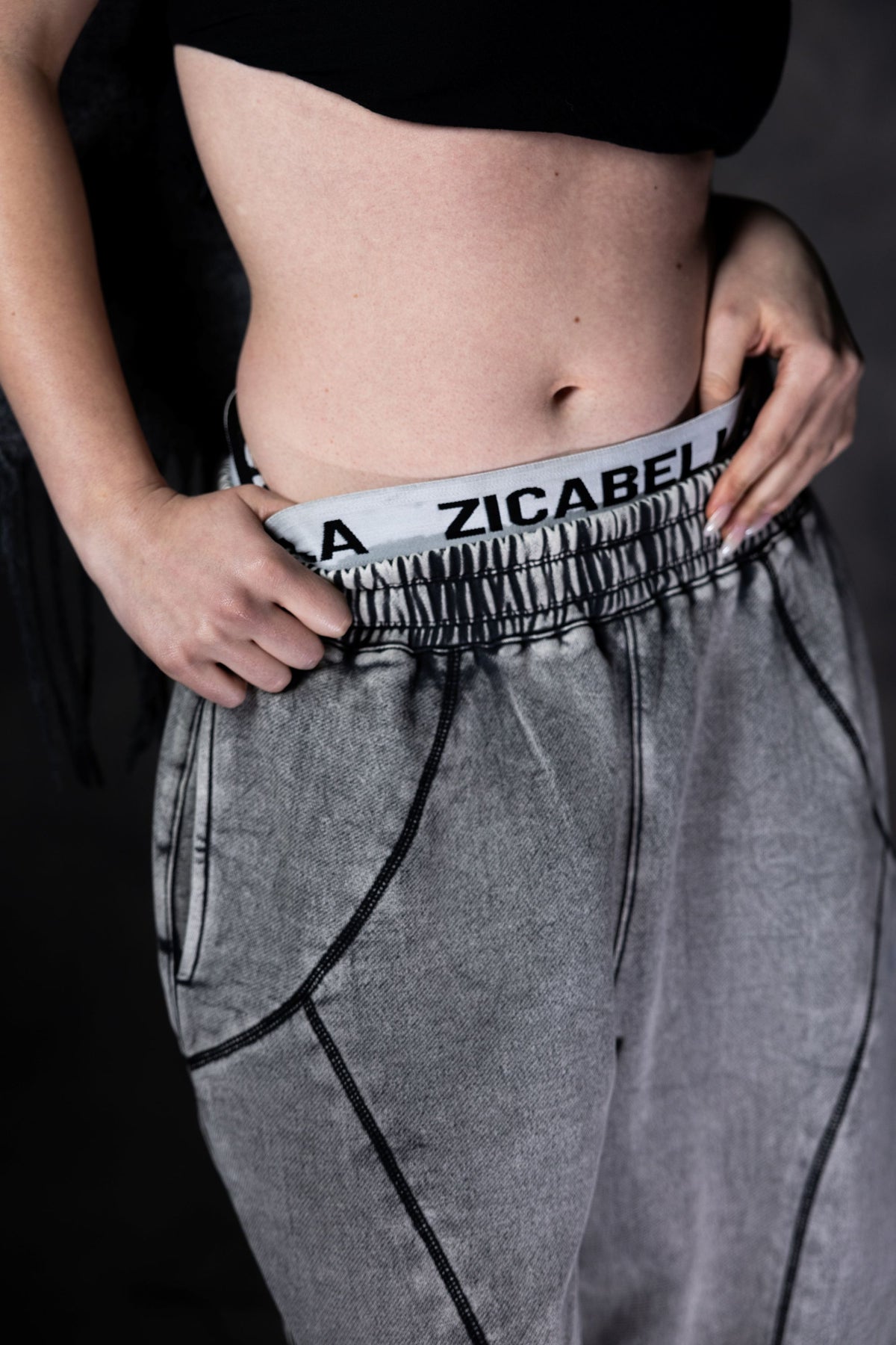 Grey baggy streetwear lower with close up detail adding edgy and modern urban look