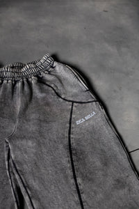 Close up stitching detail of grey baggy lower showcasing clean finish and quality build