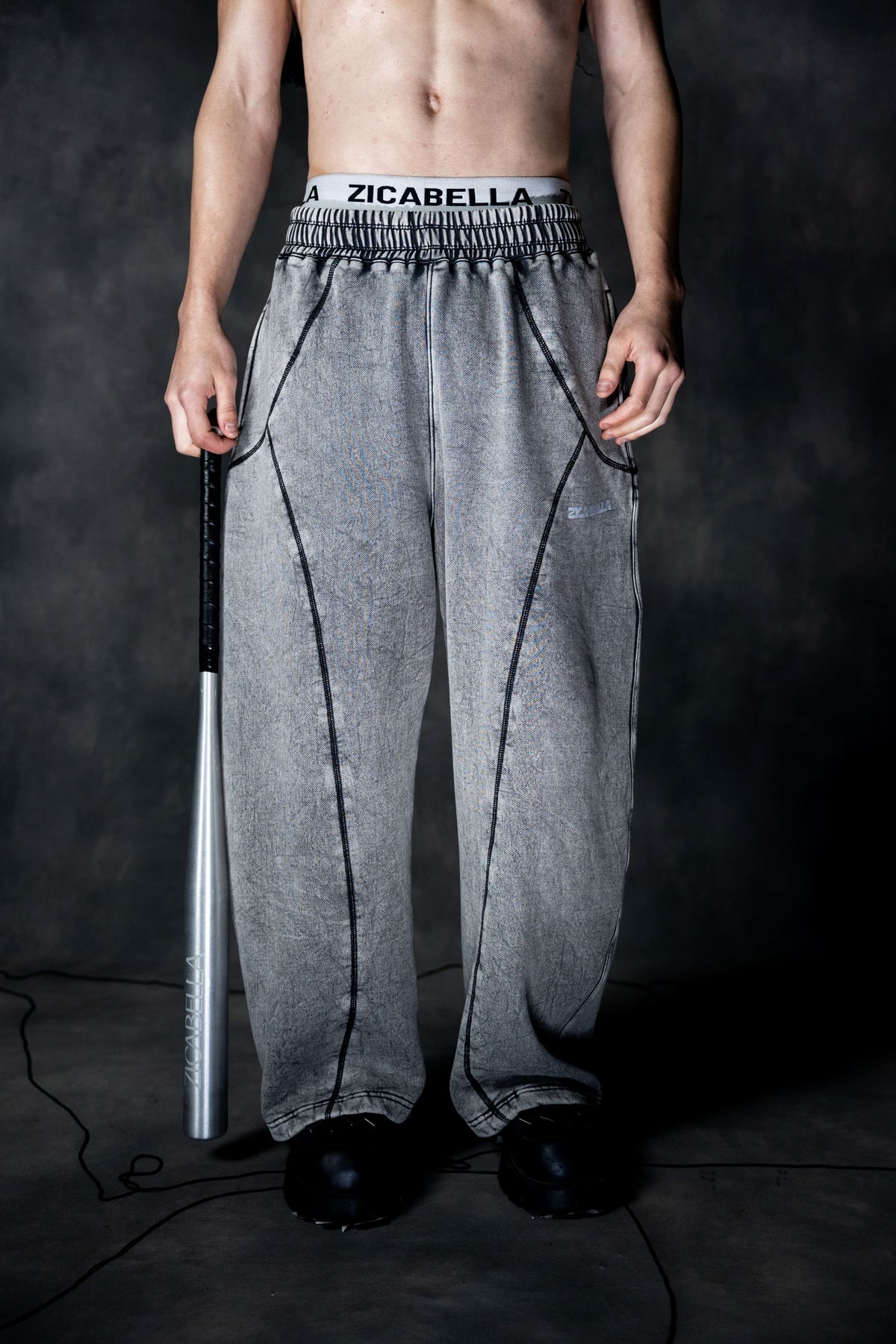 Front view of grey baggy lower featuring loose fit and elastic waistband for streetwear styling
