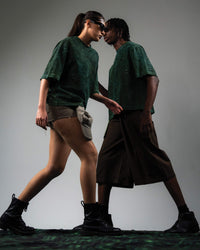Editorial fashion pose featuring GRN_ERR green acid wash oversized tee