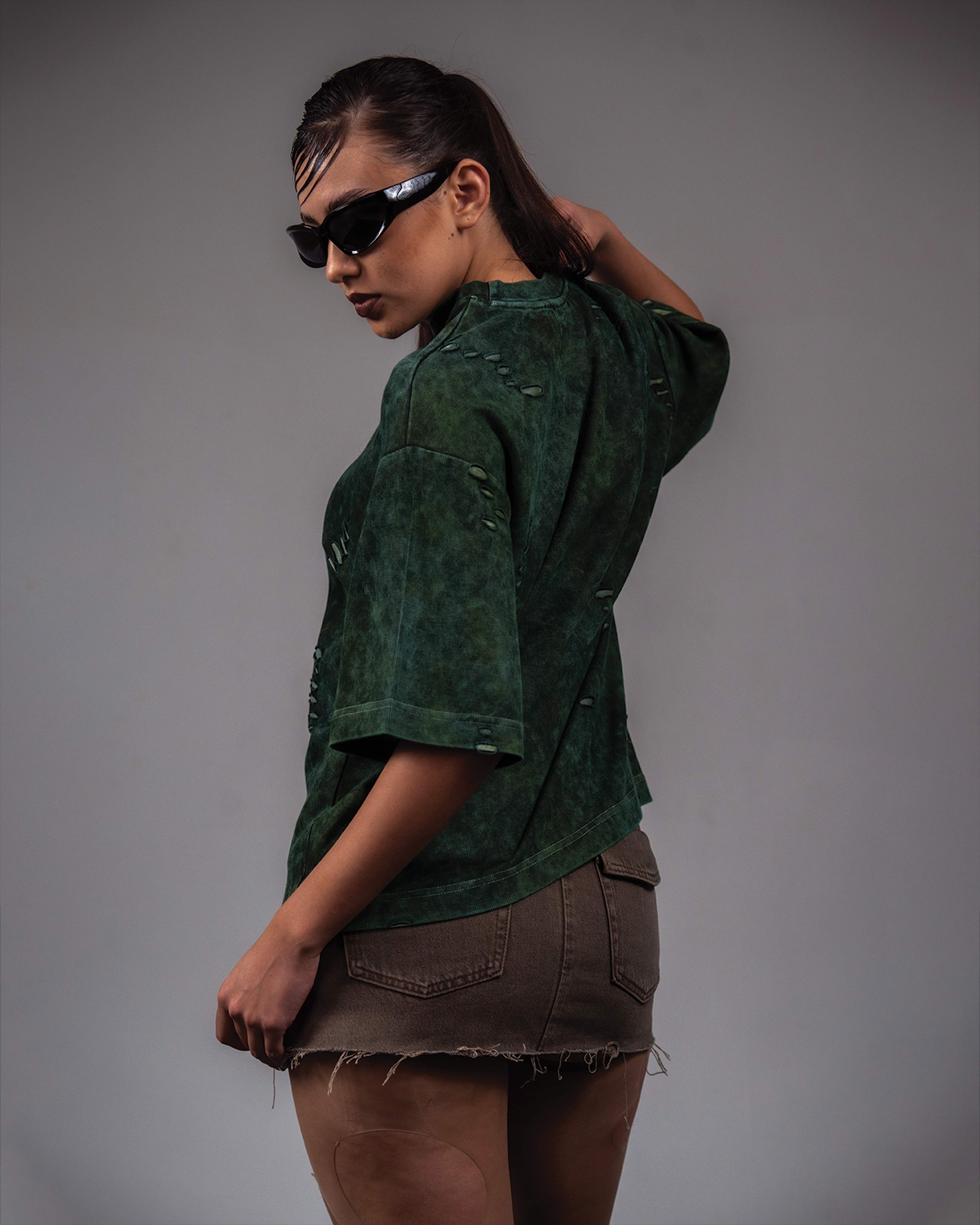 Couple fashion editorial photoshoot featuring GRN_ERR oversized distressed green t shirt