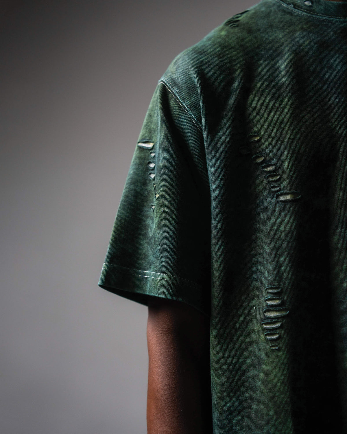 Sleeve detail of GRN_ERR distressed oversized green acid wash t shirt