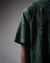 Sleeve detail of GRN_ERR distressed oversized green acid wash t shirt