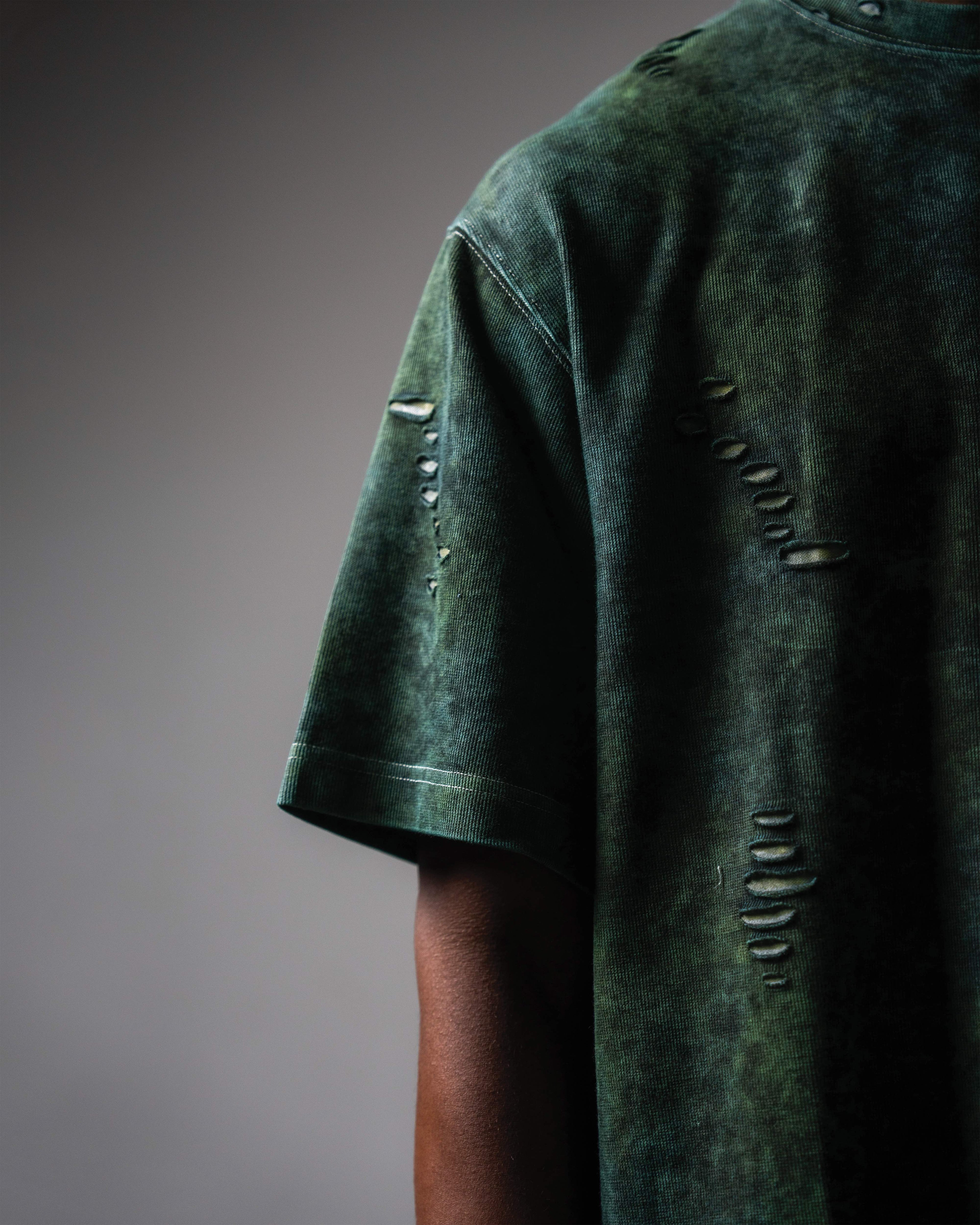 Sleeve detail of GRN_ERR distressed oversized green acid wash t shirt