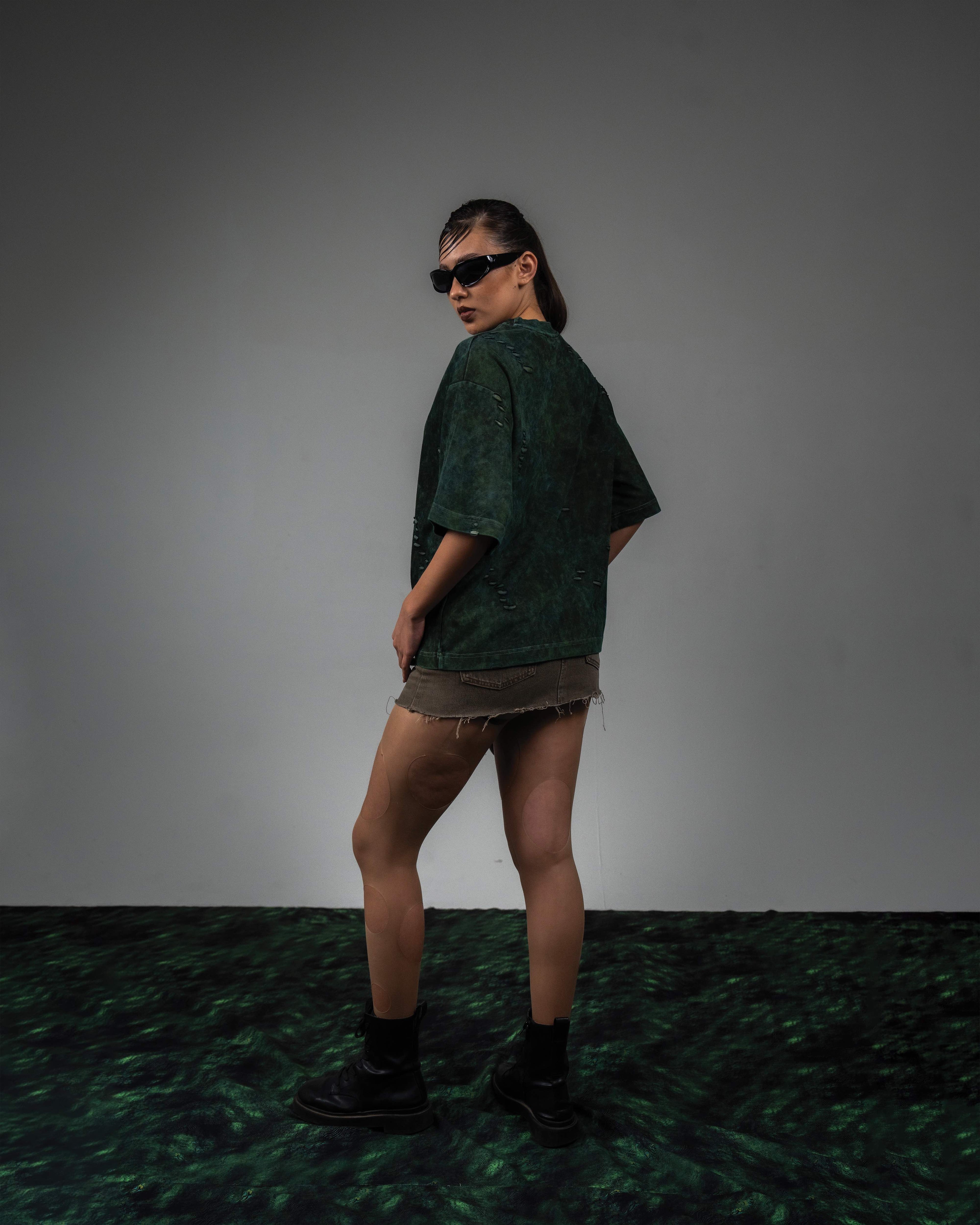 Female side back fit look in GRN_ERR green vintage wash streetwear t shirt