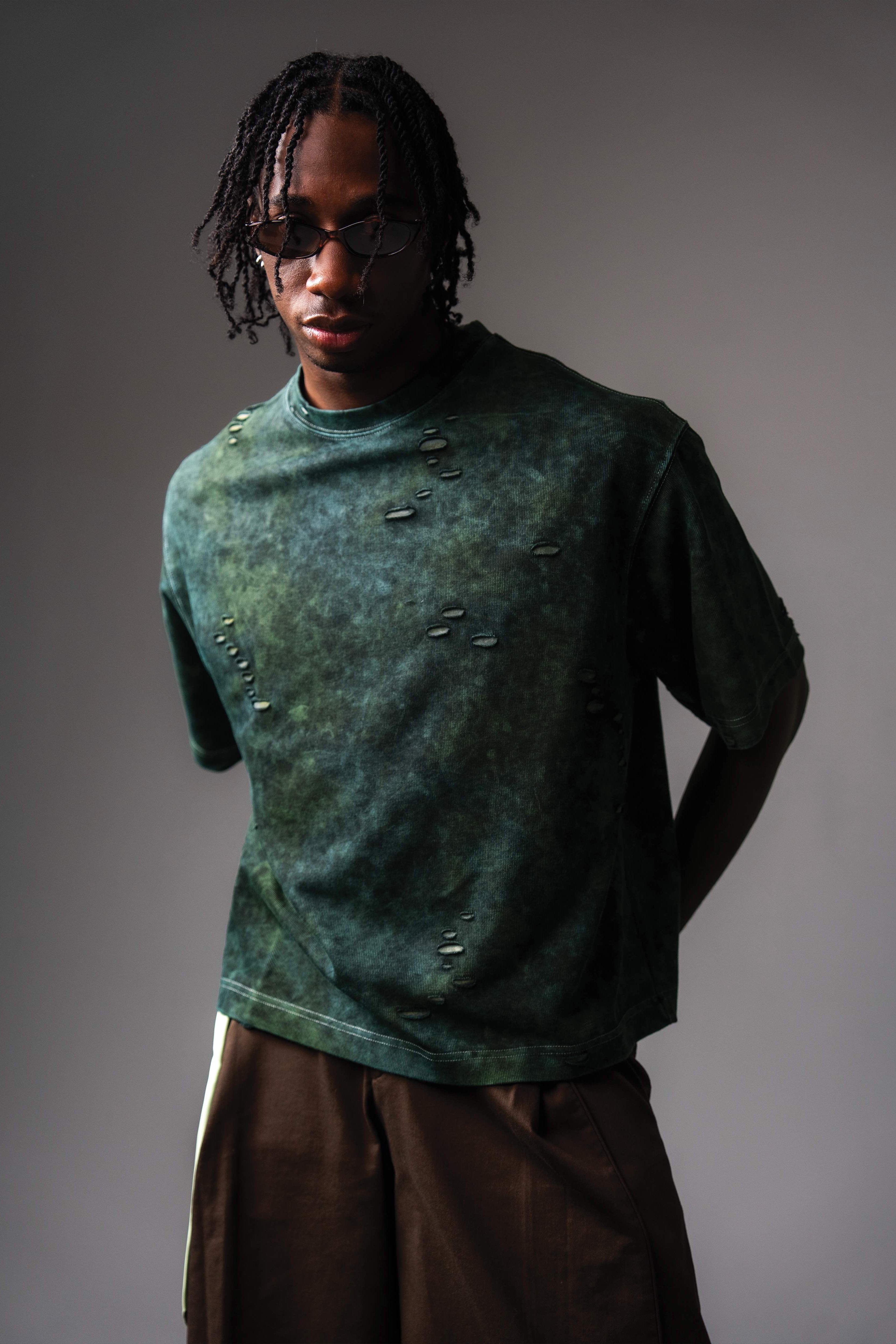 Front portrait view of GRN_ERR green acid wash oversized streetwear tee