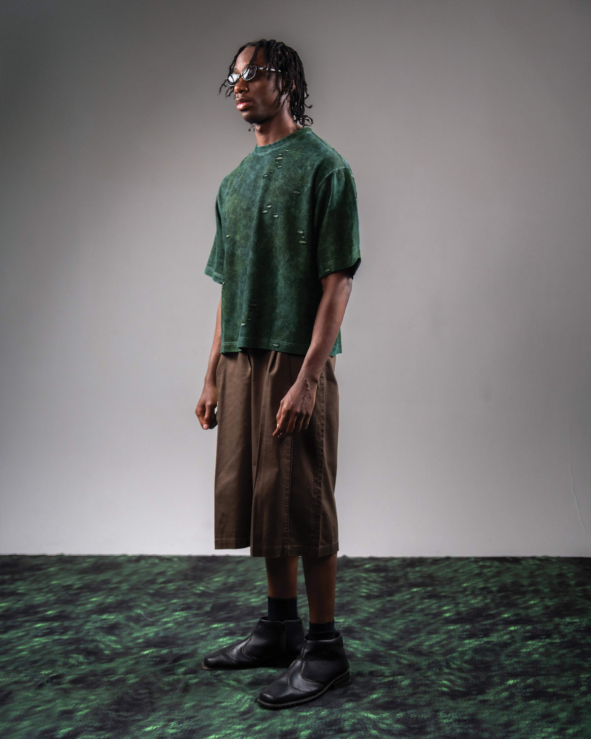Side profile fit of GRN_ERR green oversized streetwear t shirt