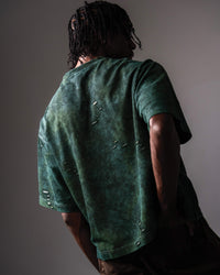 Back view of GRN_ERR green oversized distressed streetwear t shirt