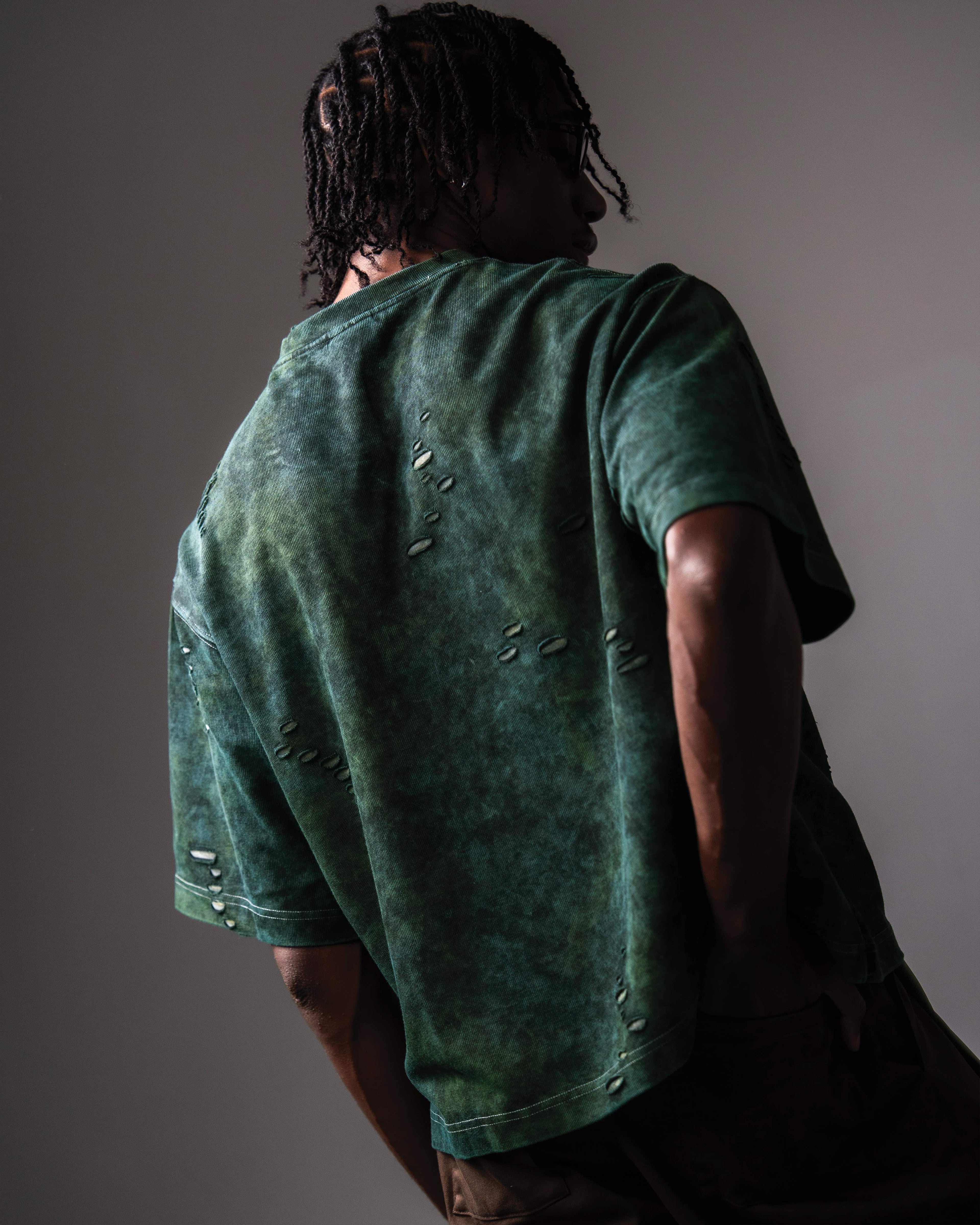 Back view of GRN_ERR green oversized distressed streetwear t shirt