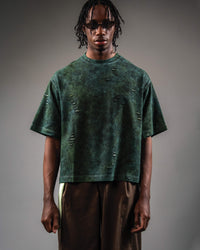 Studio front shot of GRN_ERR oversized green streetwear t shirt on model