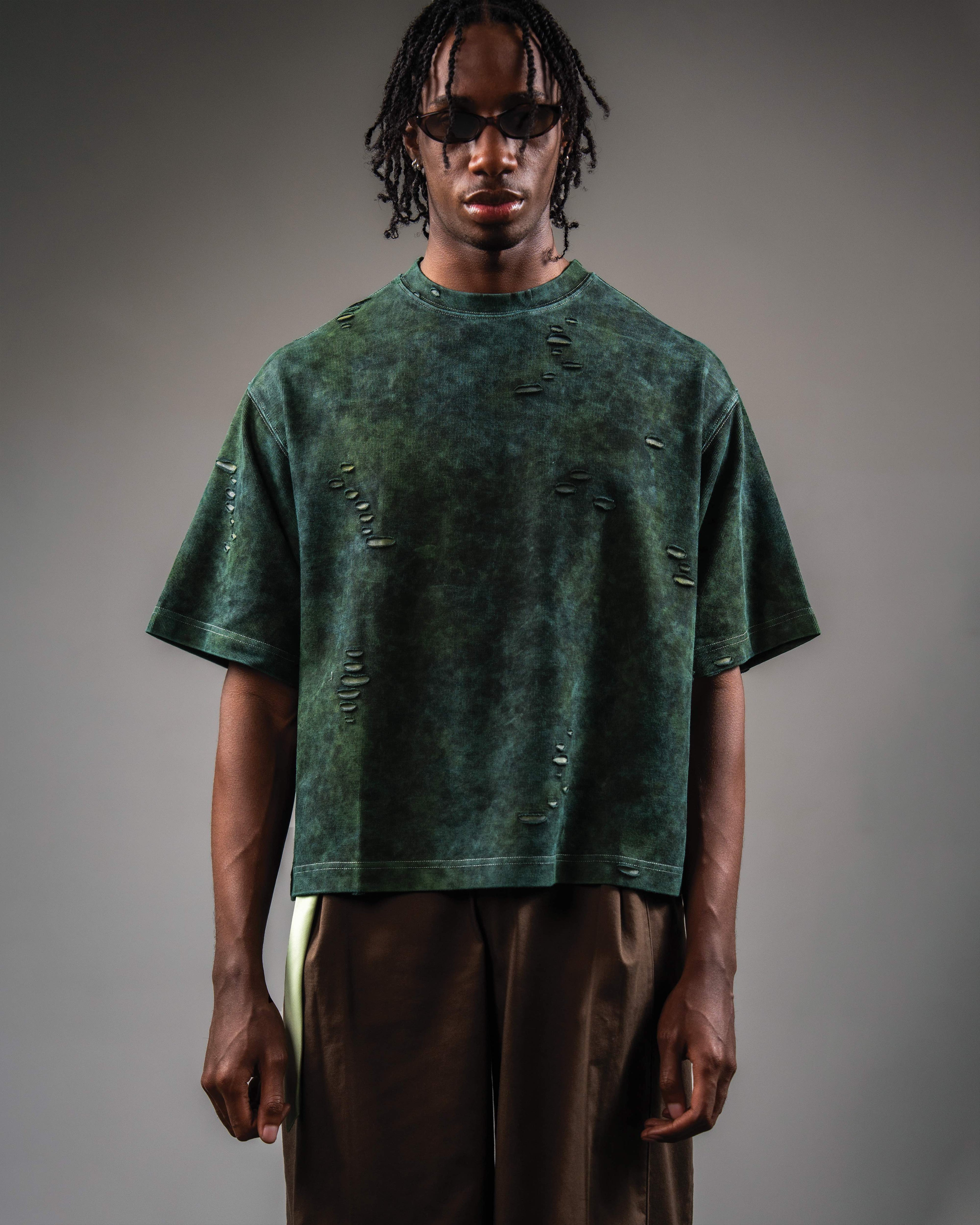 Studio front shot of GRN_ERR oversized green streetwear t shirt on model