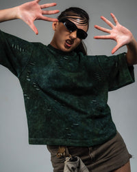 Female model wearing GRN_ERR oversized green streetwear t shirt