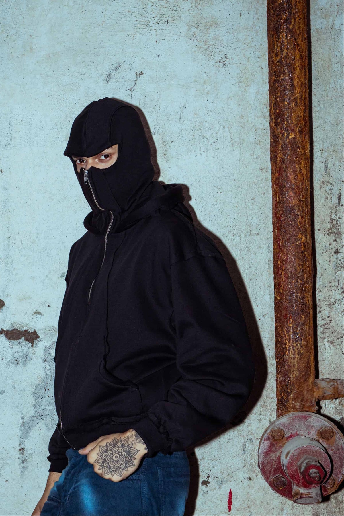 Black oversized cotton jacket with a zipper detail for an edgy look with mask 