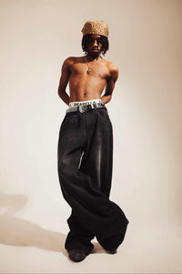 Jeans crafted from premium denim with a baggy fit and distressed detailing, offering a bold streetwear style