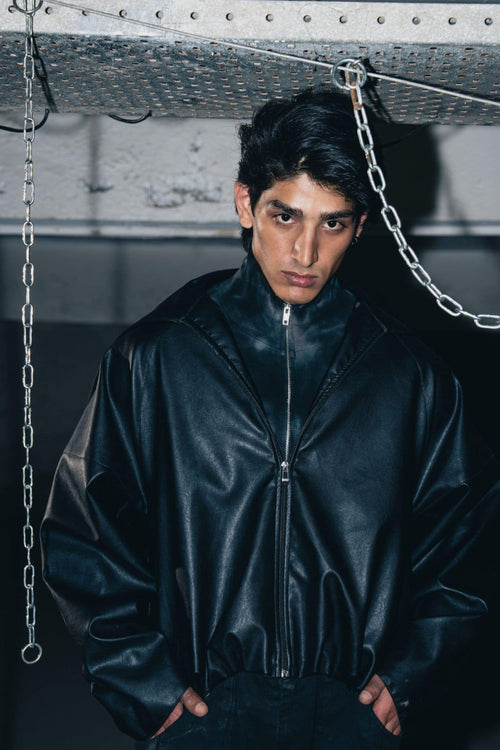 Luxury black leather biker jacket with structured design, crafted from premium leather for a tailored fit.