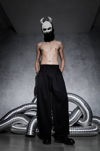 Men’s black streetwear joggers shown in front view with elastic waistband and wide leg fit, cotton polyester fabric pants styled in modern urban fashion