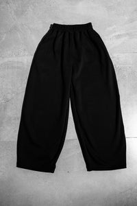 Men’s black streetwear joggers in wide leg oversized fit, premium quality pants with elastic waistband designed for modern urban fashion wear