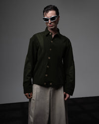 Front full shot of a man wearing a dark olive oversized textured shirt