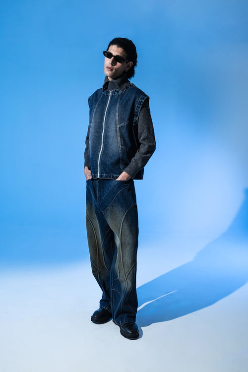 Men wearing sleeveless denim jacket styled with jeans for modern urban streetwear look