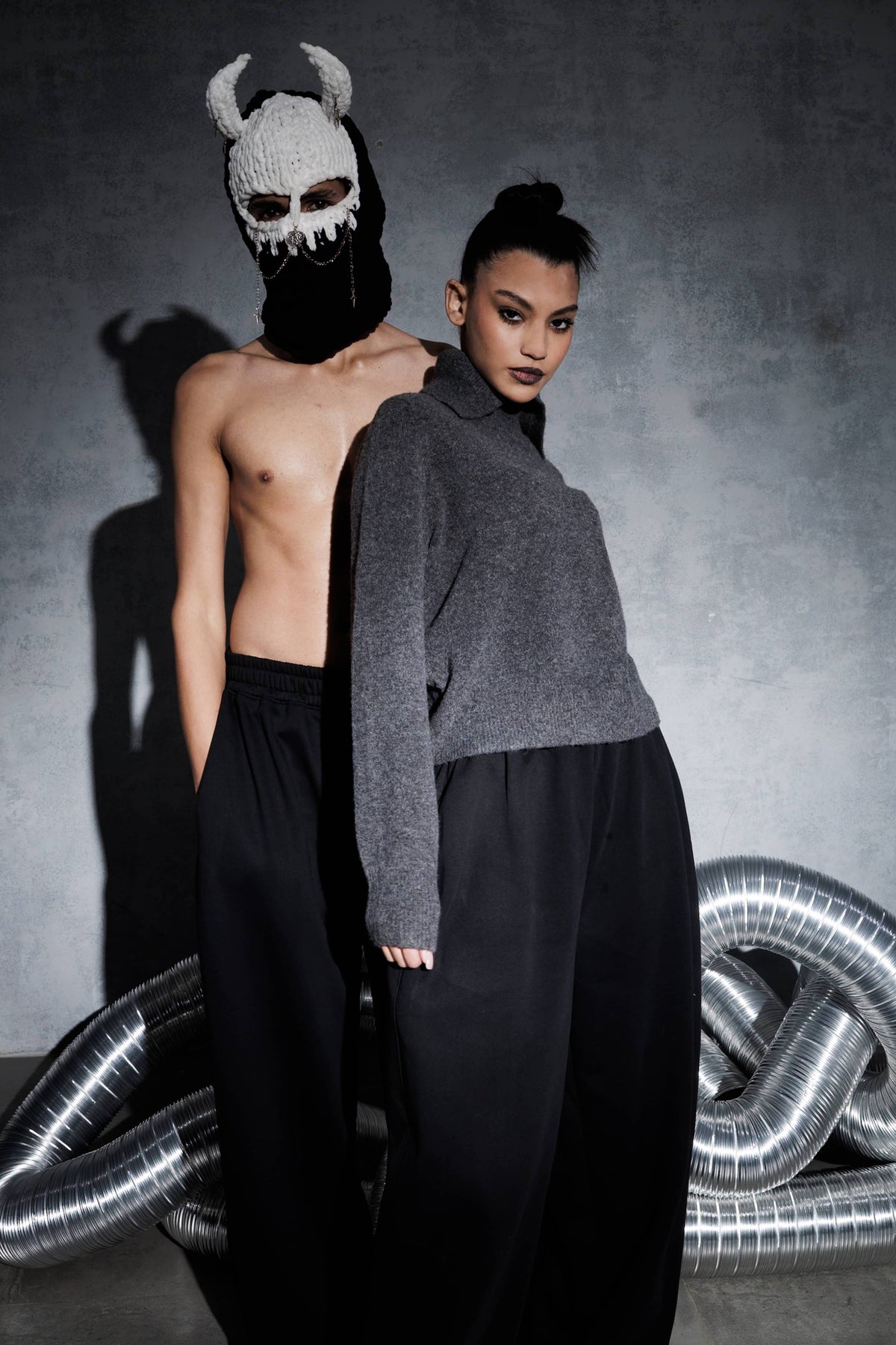 Men’s black oversized streetwear joggers with wide leg fit, premium quality pants styled in modern urban fashion editorial look