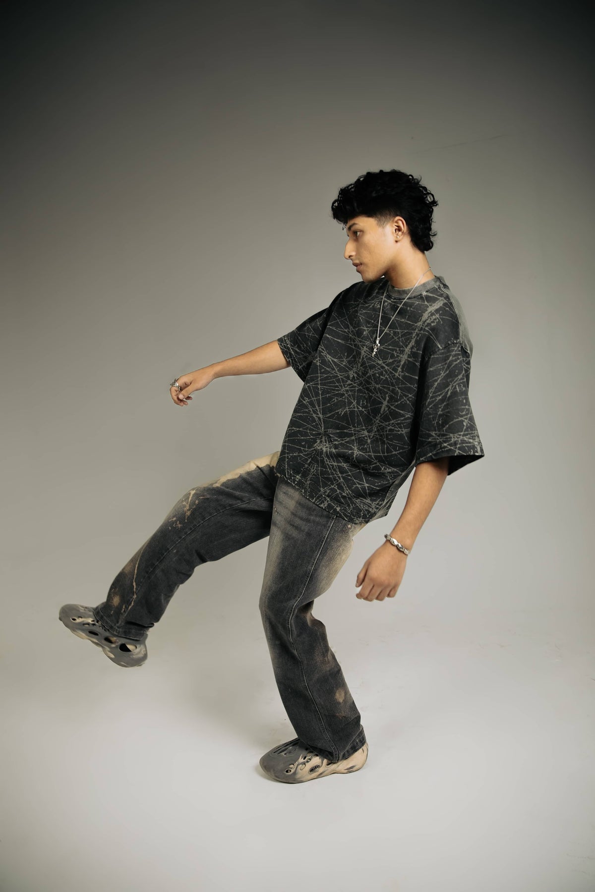 Cool oversized black acid-wash t-shirt for men, a bold addition to streetwear wardrobes