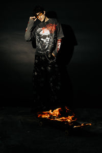 Street-inspired look featuring oversized black acid washed t-shirt with graphic design