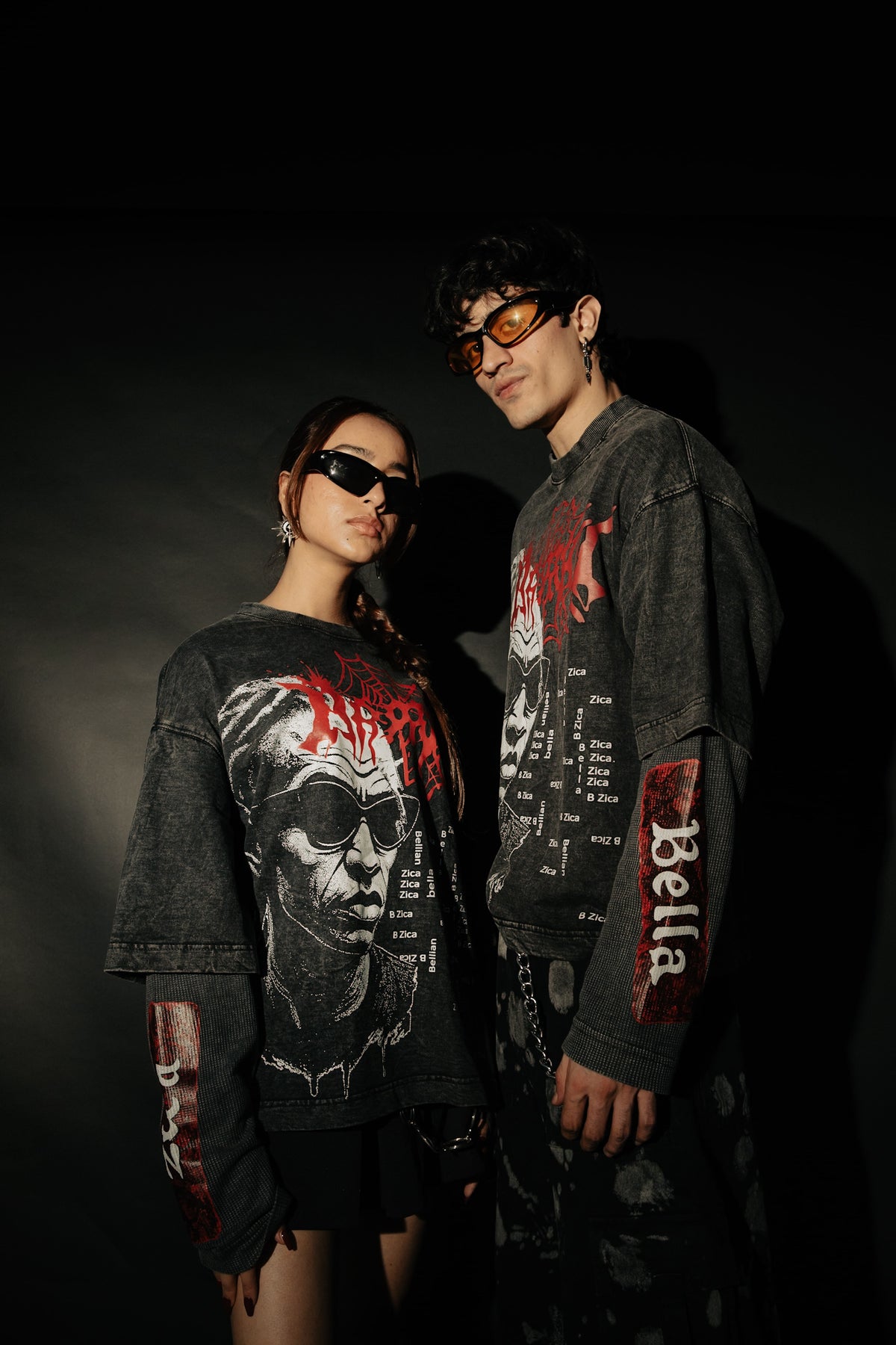 Close-up of the bold graphic print on an oversized black acid washed t-shirt