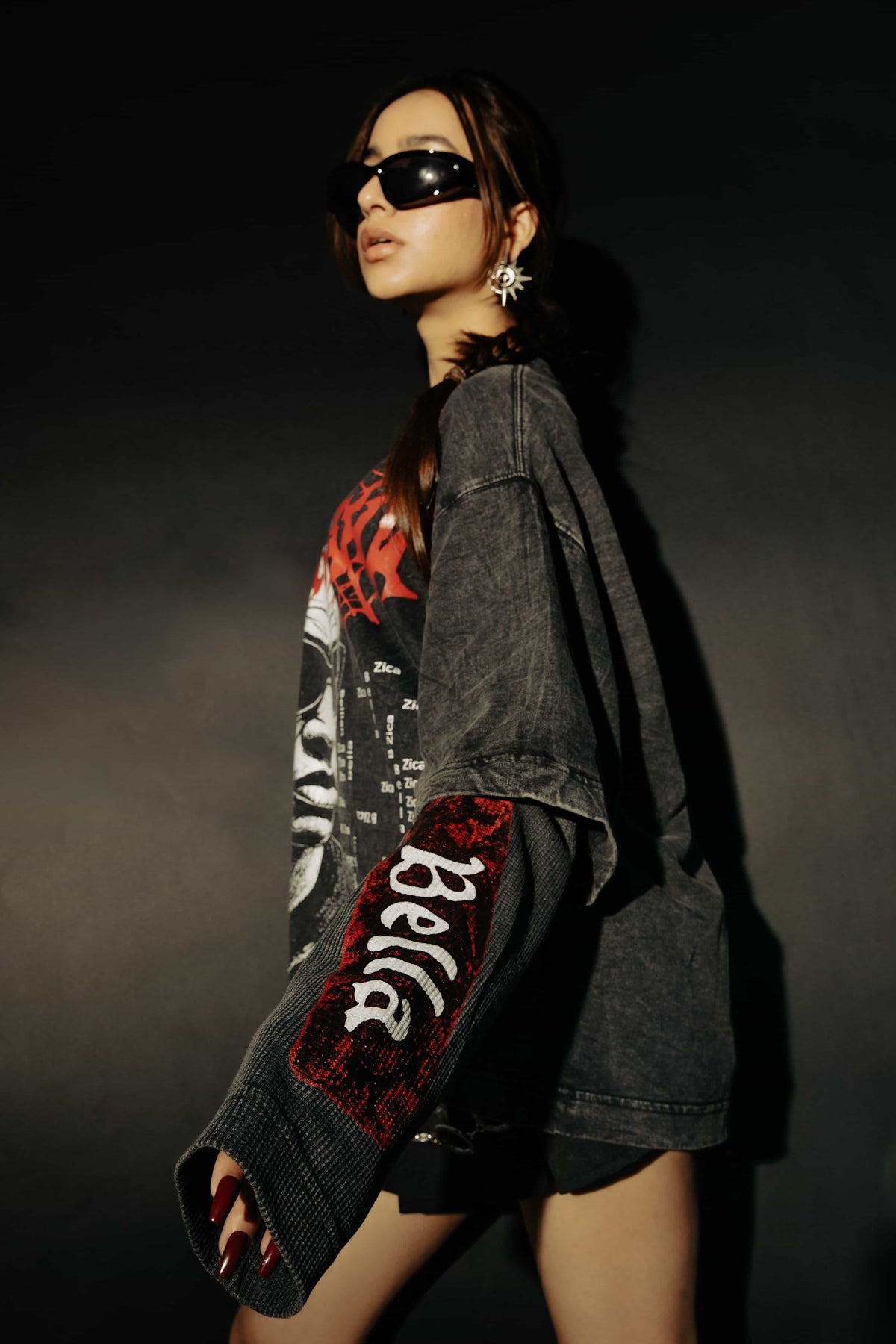 Close-up of bold graphic artwork on an oversized black cotton t-shirt