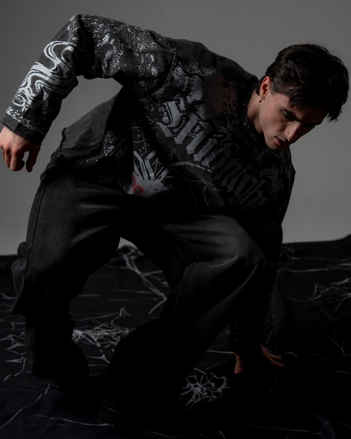 Front view showcasing the relaxed drape, premium vintage wash, and screenprint silhouette of an oversized long sleeve streetwear tee