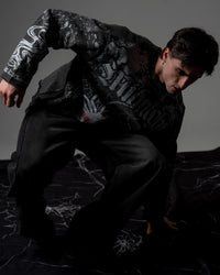 Front view showcasing the relaxed drape, premium vintage wash, and screenprint silhouette of an oversized long sleeve streetwear tee